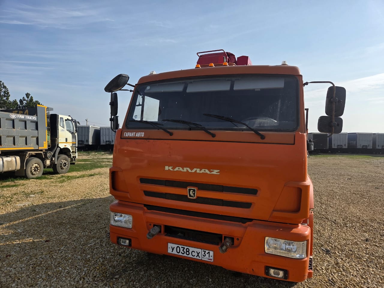 Кран центр "КАМАЗ" 6590* на шасси КамАЗ 65115 6x4 Бортовой с КМУ 2022 г.