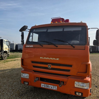 Кран центр "КАМАЗ" 6590* на шасси КамАЗ 65115 6x4 Бортовой с КМУ